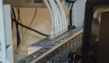 Close-up of Ethernet cable showing four twisted pairs of wires used for data transmission.
